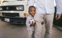 Father with son holding a soccer ball