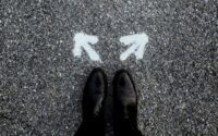 Shoes in front of 2 arrows in which a decision needs to be made