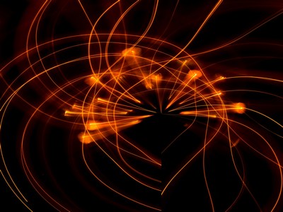 Fireworks of light steraming and forming the shape of a heart.