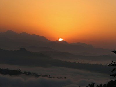 A sunset or sunrise over a dry area.