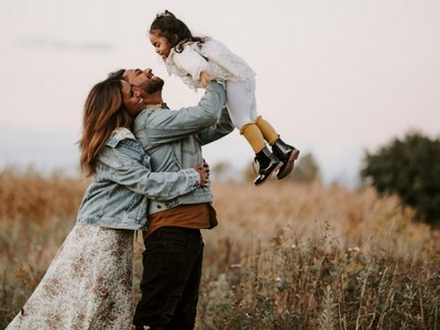 A family in a field of grass.
